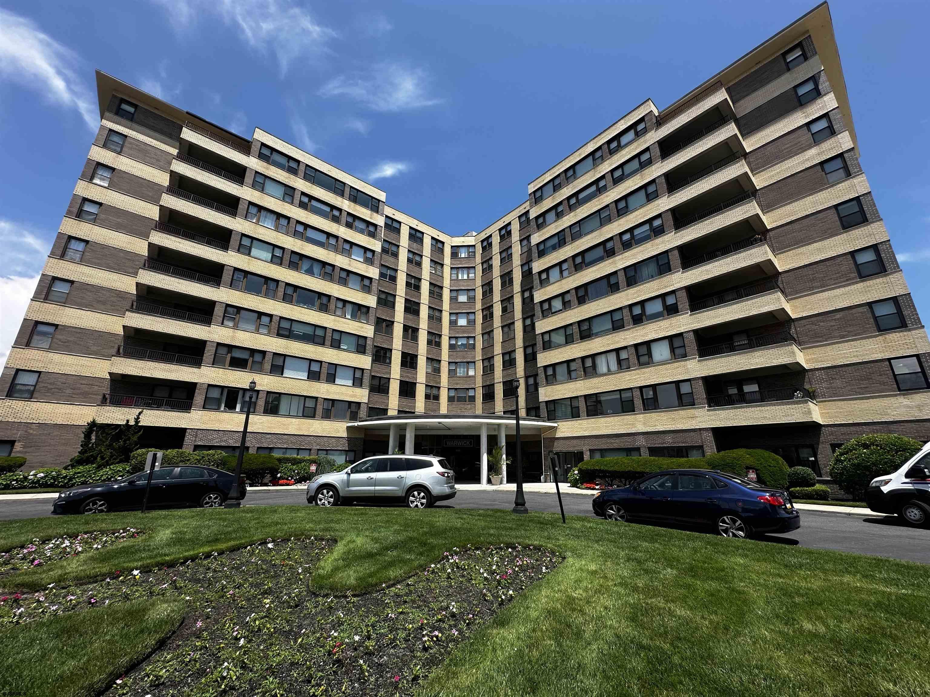101 South Raleigh Avenue, Unit 232 Atlantic City, NJ 08401 - Photo 2 of 18 a front view of a building with a garden