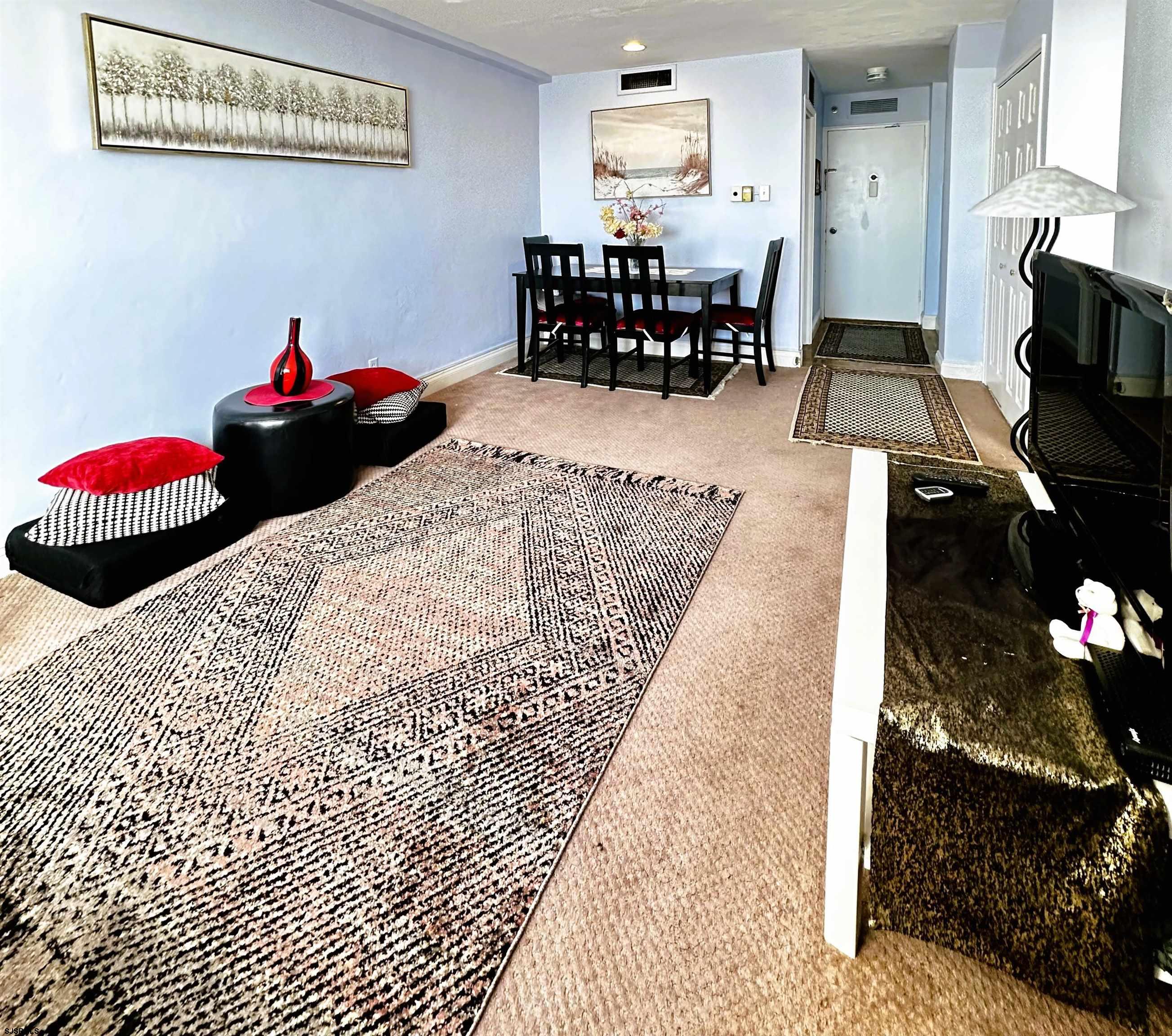 101 South Raleigh Avenue, Unit 232 Atlantic City, NJ 08401 - Photo 4 of 18 a living room with furniture and a wooden floor