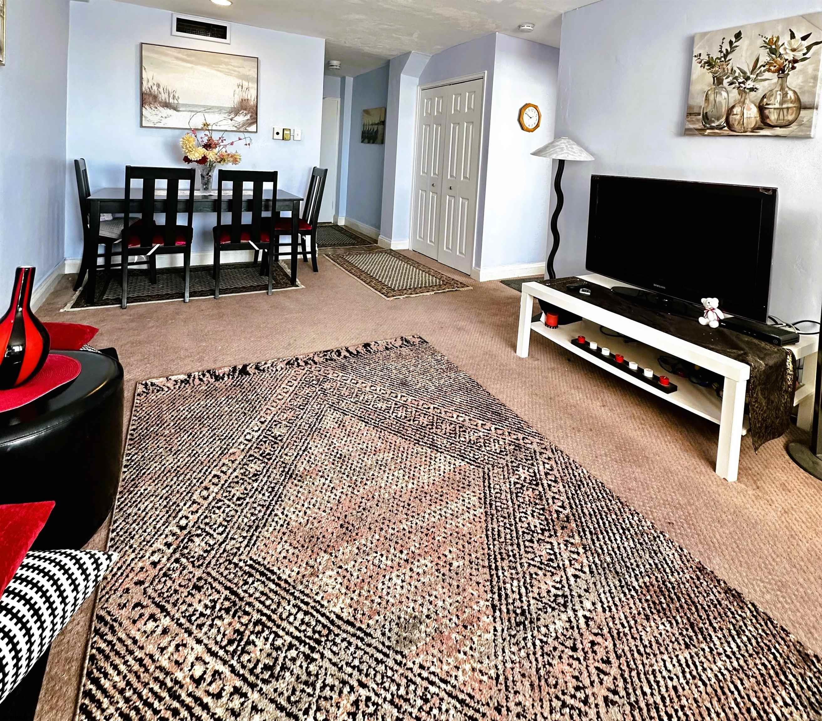 101 South Raleigh Avenue, Unit 232 Atlantic City, NJ 08401 - Photo 5 of 18 a living room with furniture a flat screen tv and a table