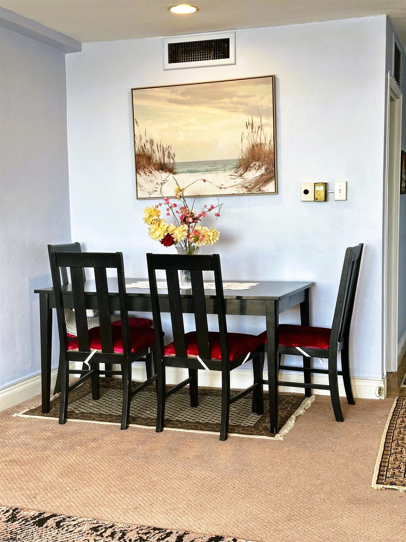 101 South Raleigh Avenue, Unit 232 Atlantic City, NJ 08401 - Photo 6 of 18 a view of a dining room with furniture and a large window