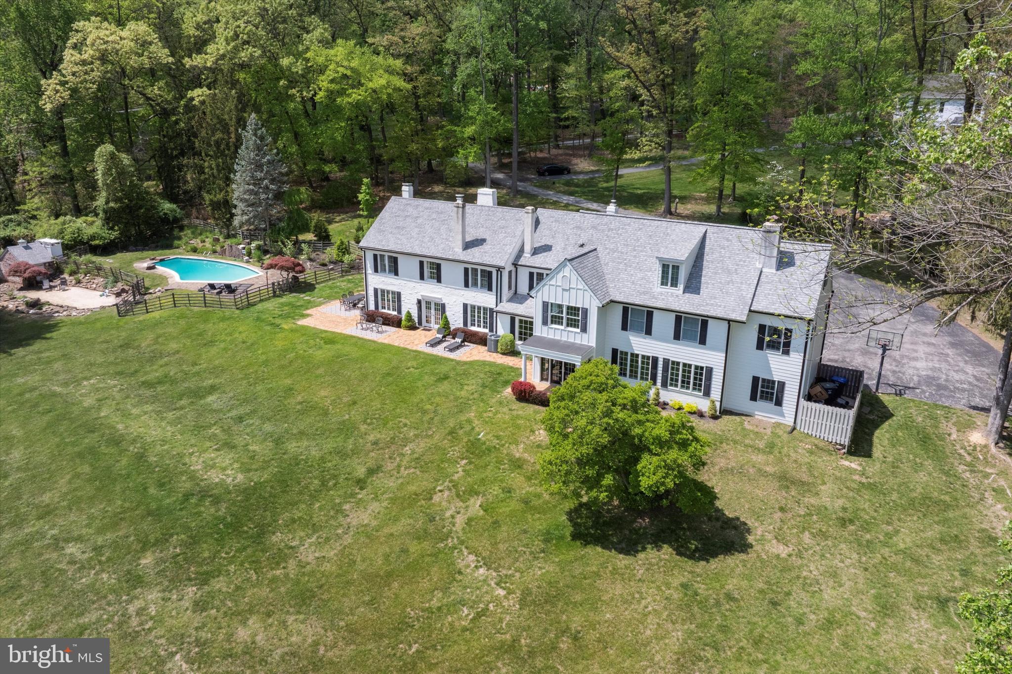 2031 Diamond Rock Road Malvern, PA 19355 - Photo 2 of 51 an aerial view of a house with a garden and trees