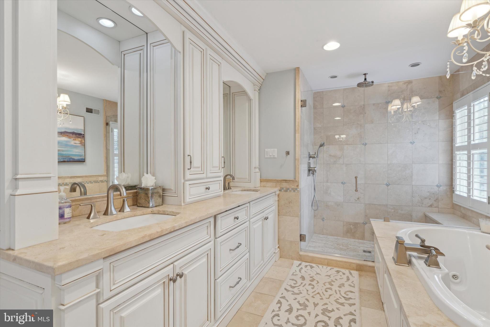 2031 Diamond Rock Road Malvern, PA 19355 - Photo 28 of 51 a bathroom with a granite countertop double vanity sink a mirror a shower and a bathtub