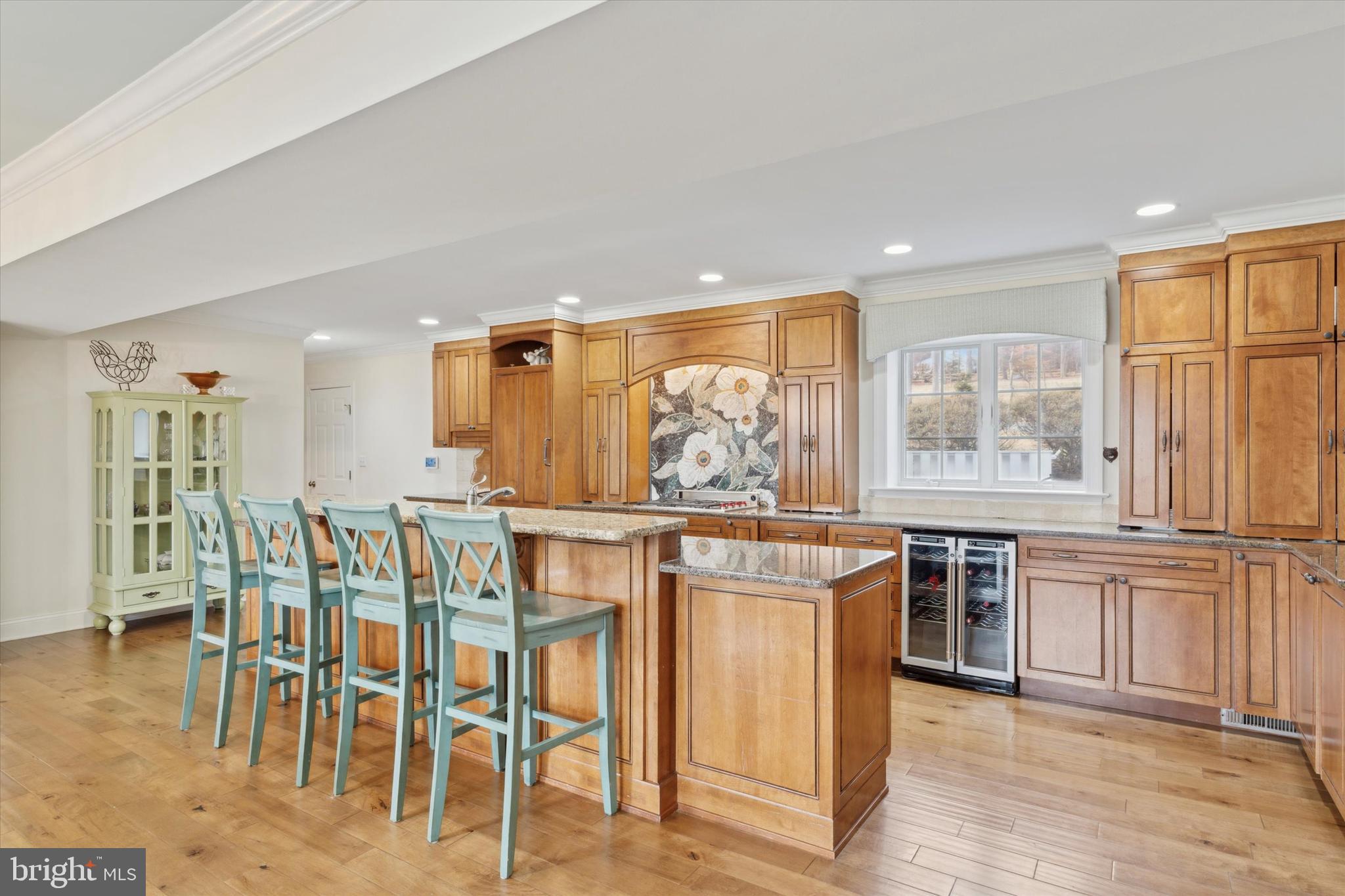 2031 Diamond Rock Road Malvern, PA 19355 - Photo 8 of 51 a kitchen with stainless steel appliances granite countertop a stove a refrigerator a dining table and chairs with wooden floor