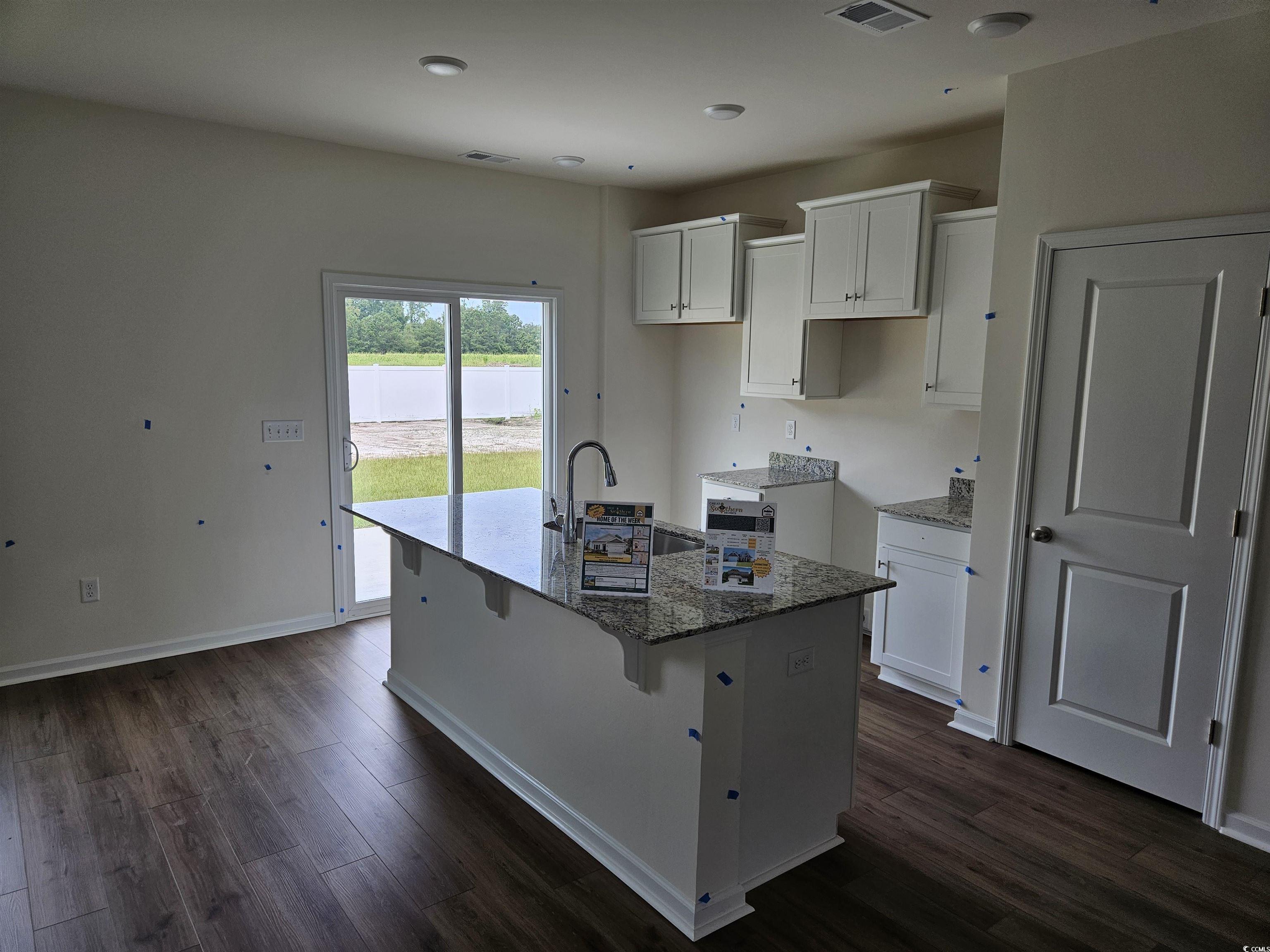 440 Hallie Martin Road Conway, SC 29527 - Photo 3 of 9 Kitchen featuring white cabinets, dark hardwood /
