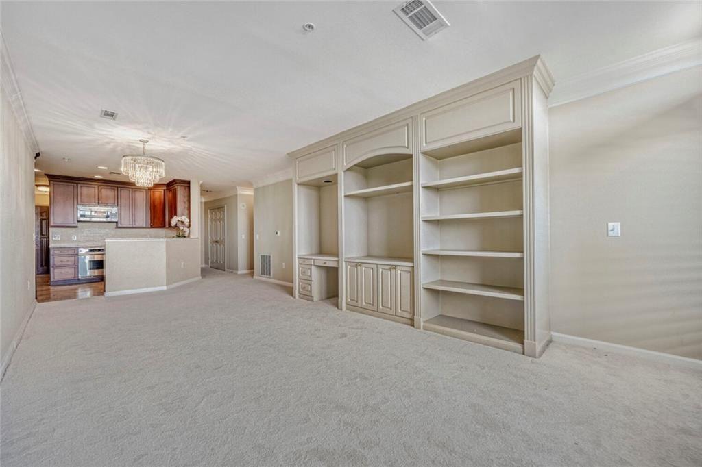 3334 Peachtree Road Northeast, Unit 1208 Atlanta, GA 30326 - Photo 5 of 23 a view of a room with cabinet and refrigerator
