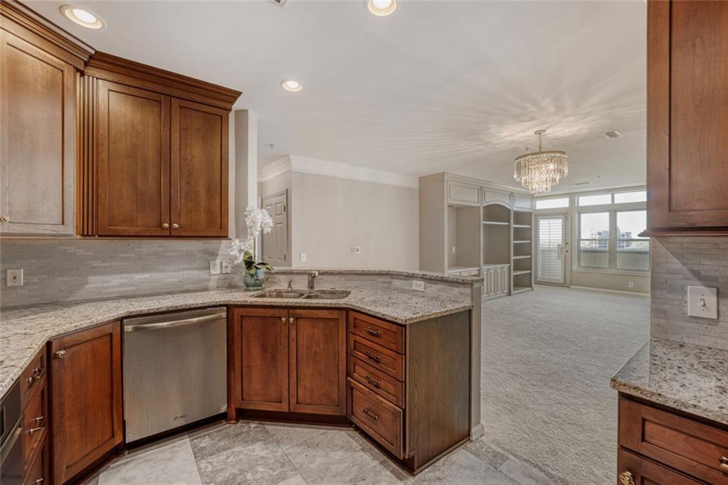 3334 Peachtree Road Northeast, Unit 1208 Atlanta, GA 30326 - Photo 6 of 23 a kitchen with a sink and cabinets