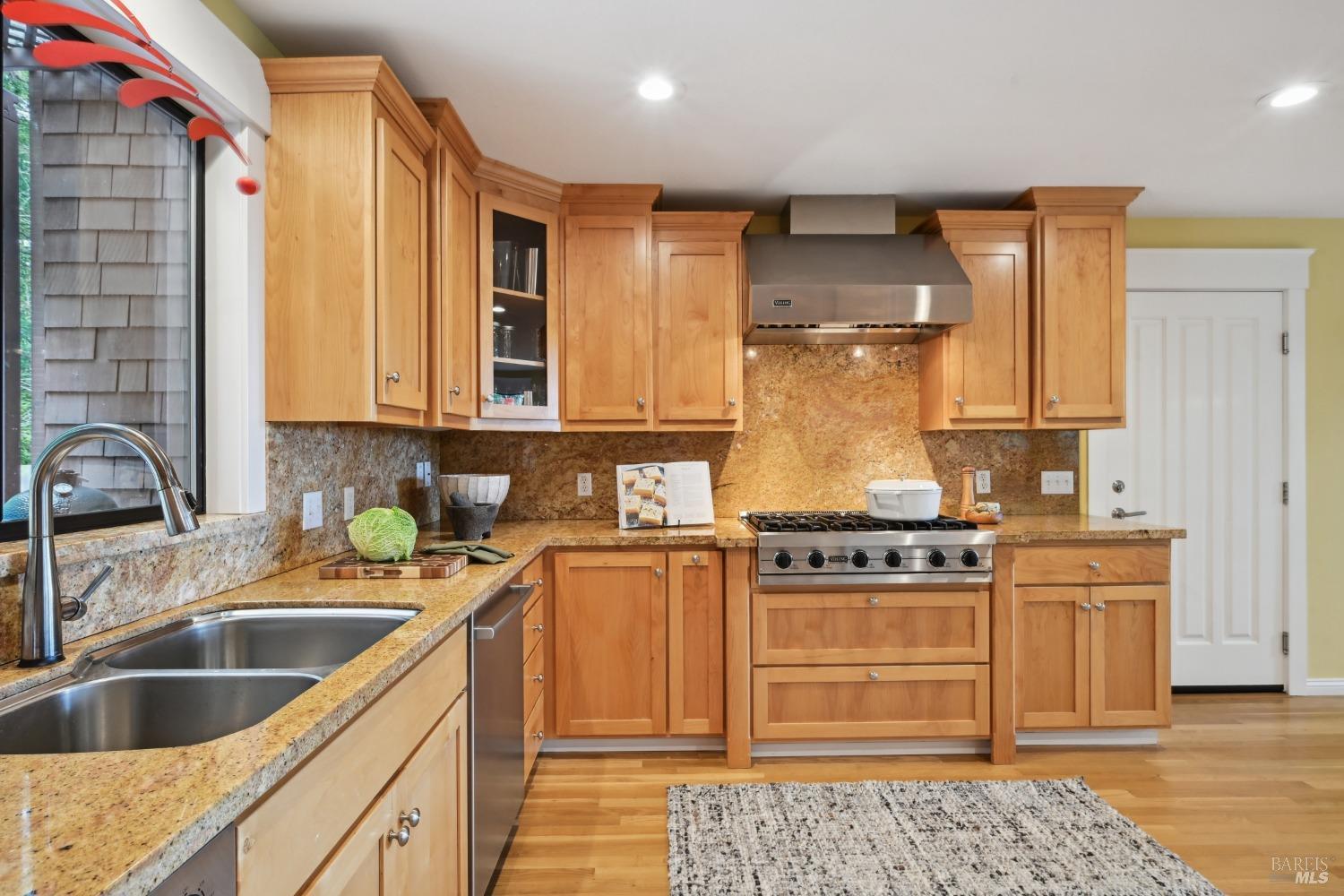 16495 Burl Lane Occidental, CA 95465 - Photo 13 of 31 a kitchen with stainless steel appliances granite countertop a sink stove and refrigerator