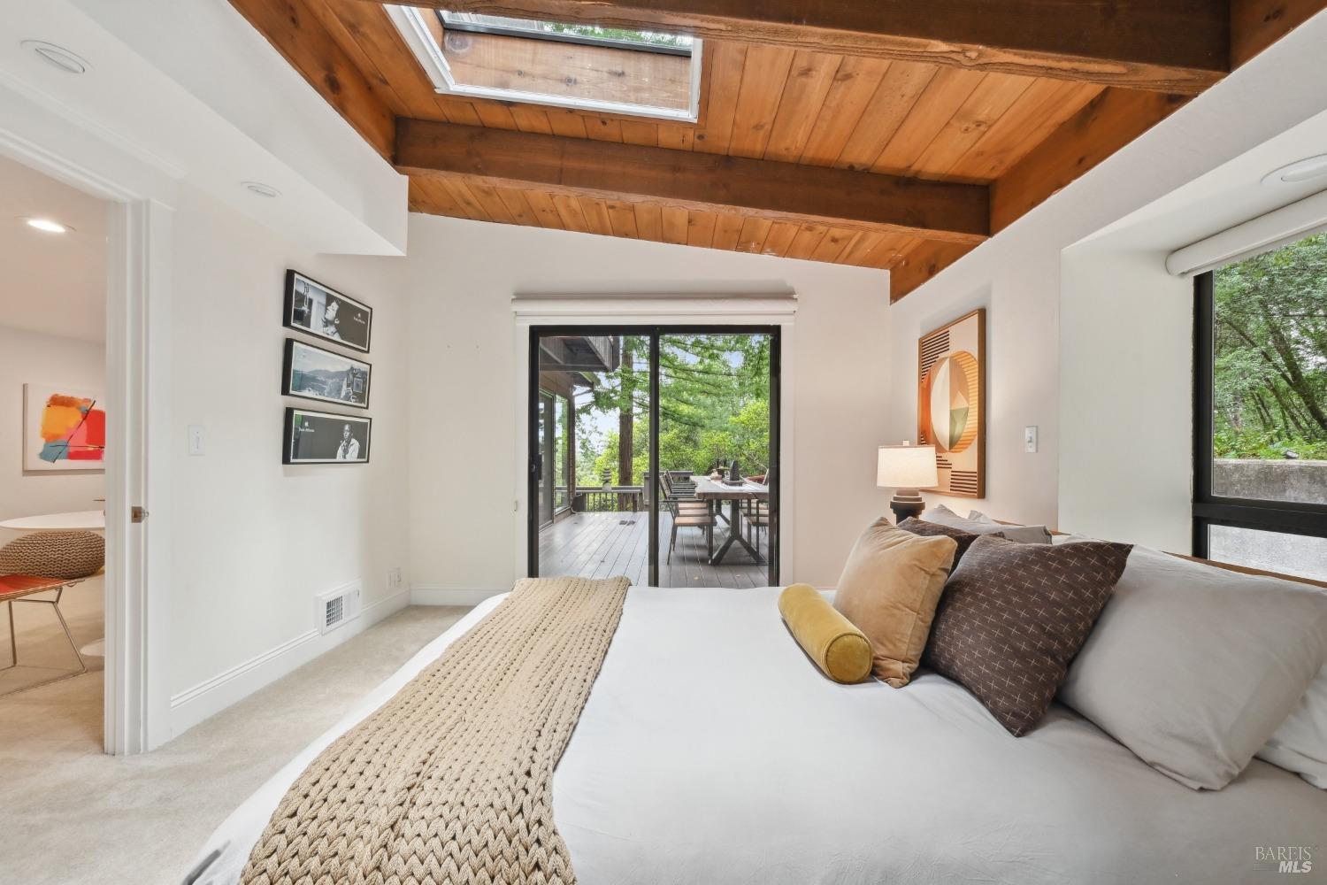 16495 Burl Lane Occidental, CA 95465 - Photo 15 of 31 a bedroom with a large bed and a large window