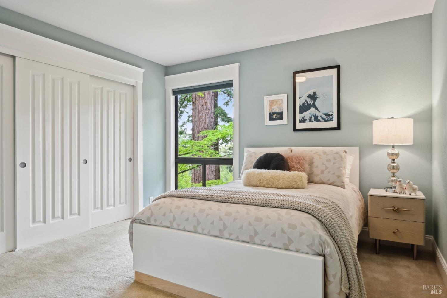 16495 Burl Lane Occidental, CA 95465 - Photo 18 of 31 a bedroom with a bed and a window