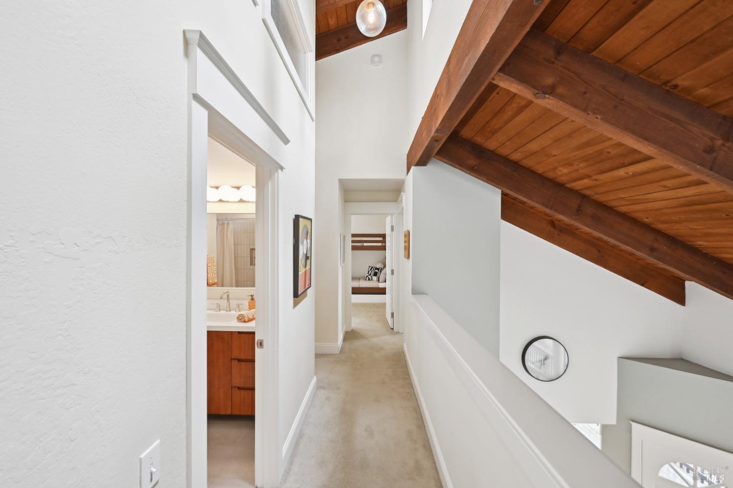 16495 Burl Lane Occidental, CA 95465 - Photo 19 of 31 a view of a hallway with wooden floor and staircase