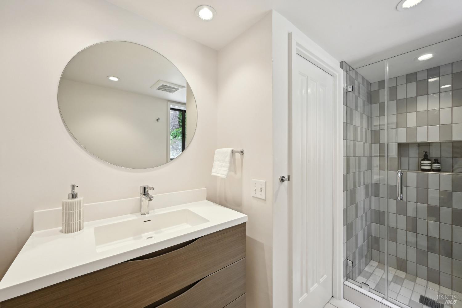 16495 Burl Lane Occidental, CA 95465 - Photo 8 of 31 a bathroom with a double vanity sink mirror and shower