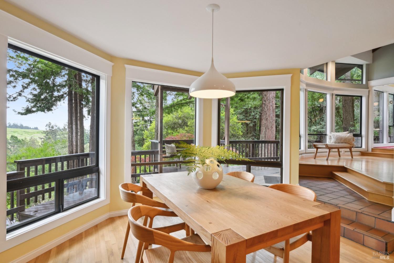 16495 Burl Lane Occidental, CA 95465 - Photo 9 of 31 a view of a dining room with furniture large windows and wooden floor