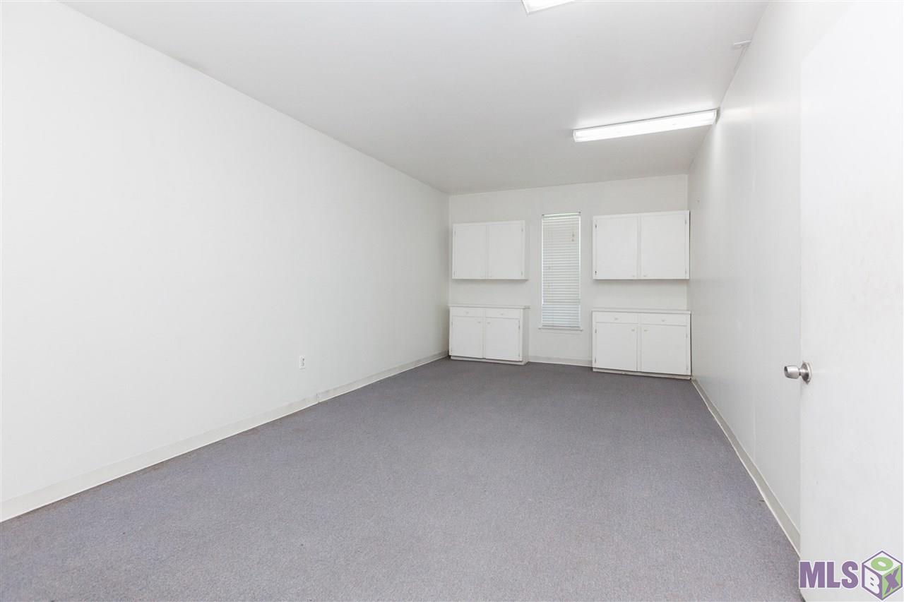 11025 Paddock Avenue Baton Rouge, LA 70816 - Photo 26 of 32 Downstairs carpeted storage room