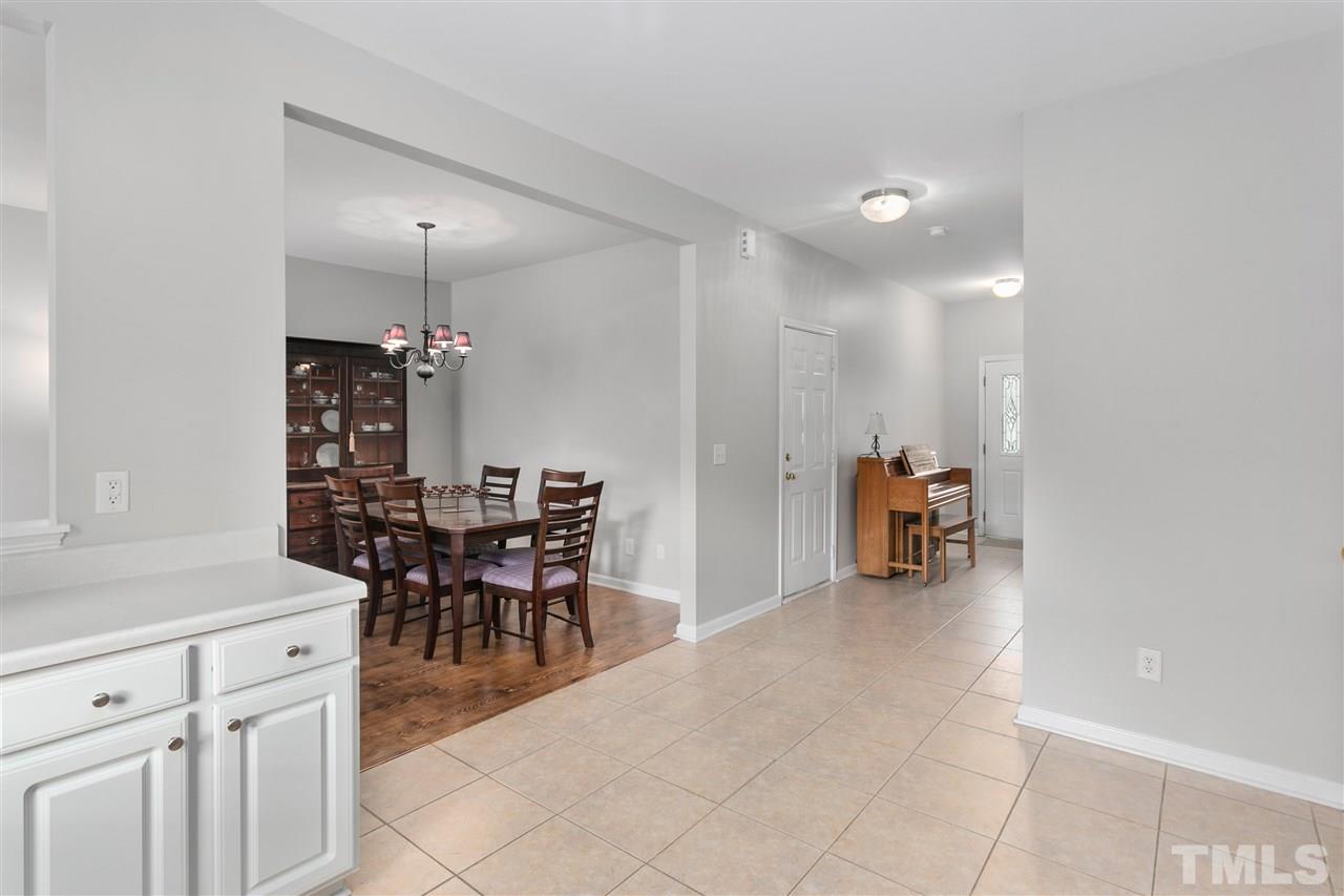 2744 Andover Glen Road Raleigh, NC 27604 - Photo 11 of 29 a view of a dining room and a livingroom with furniture