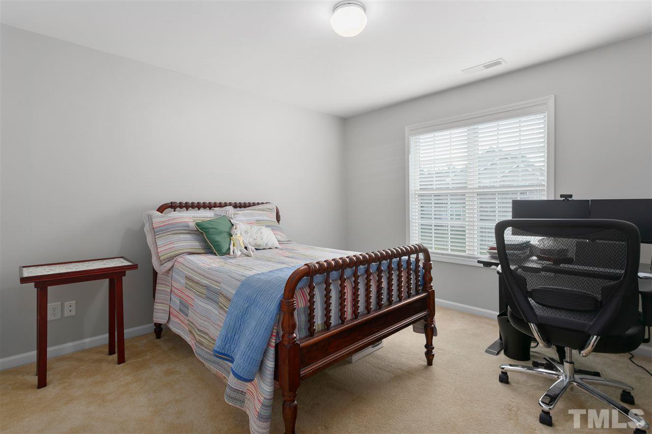 2744 Andover Glen Road Raleigh, NC 27604 - Photo 15 of 29 a bedroom with a bed and a window