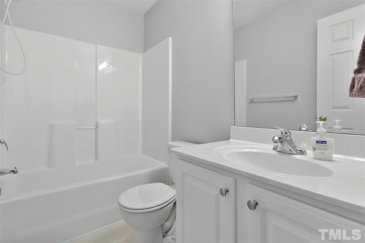 2744 Andover Glen Road Raleigh, NC 27604 - Photo 18 of 29 a bathroom with a sink toilet vanity and shower