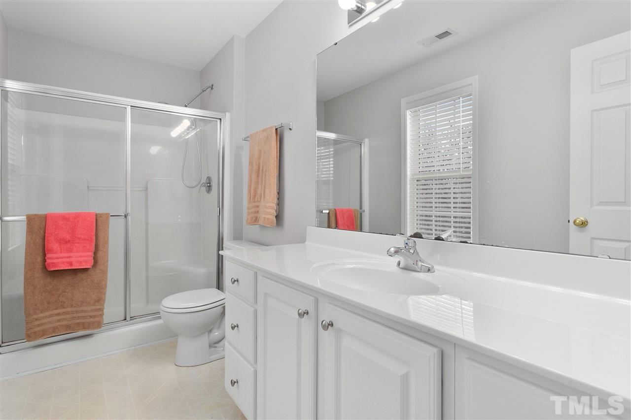 2744 Andover Glen Road Raleigh, NC 27604 - Photo 23 of 29 a bathroom with a sink and a mirror
