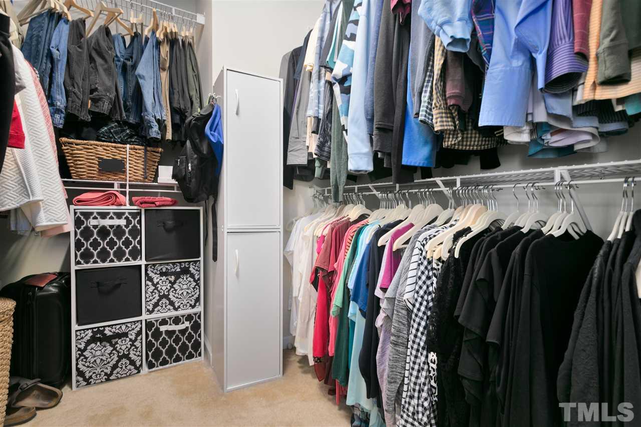2744 Andover Glen Road Raleigh, NC 27604 - Photo 24 of 29 a view of walk in closet with clothes and shoes