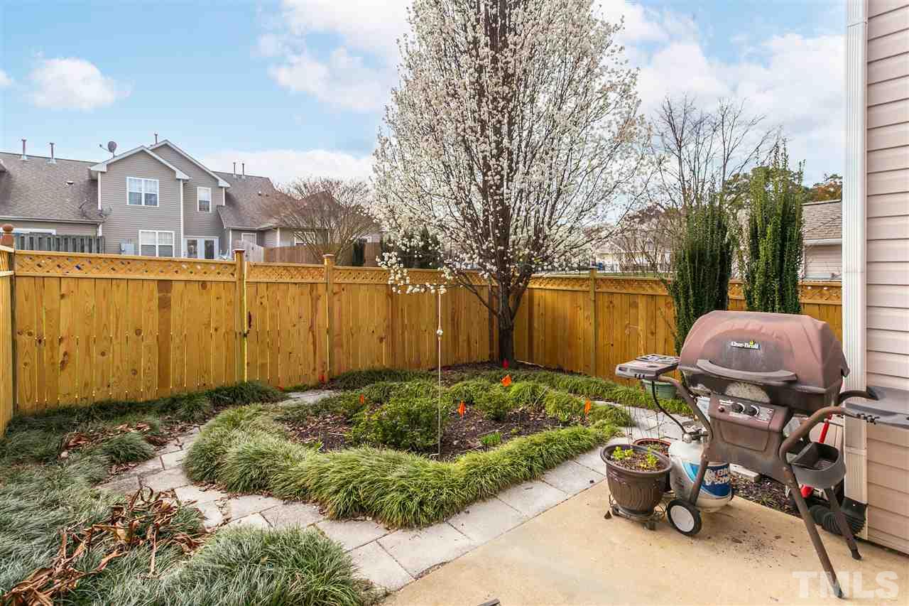 2744 Andover Glen Road Raleigh, NC 27604 - Photo 28 of 29 a view of backyard with barbeque grill and potted plants