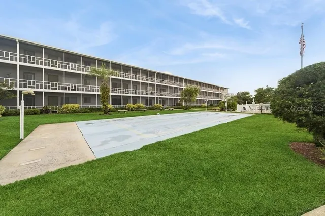 a view of outdoor space with deck and yard