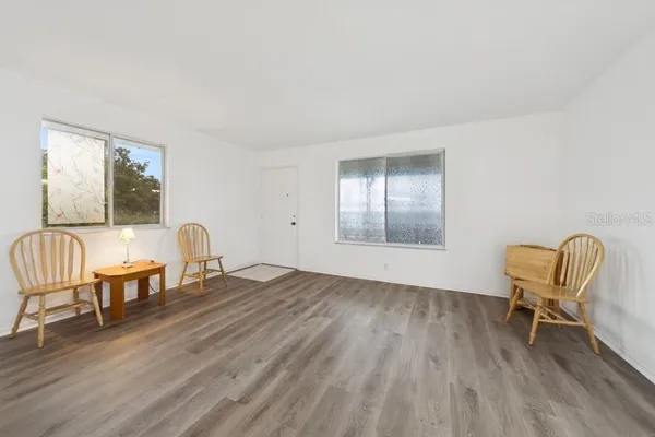 a view of a livingroom with furniture and wooden floor