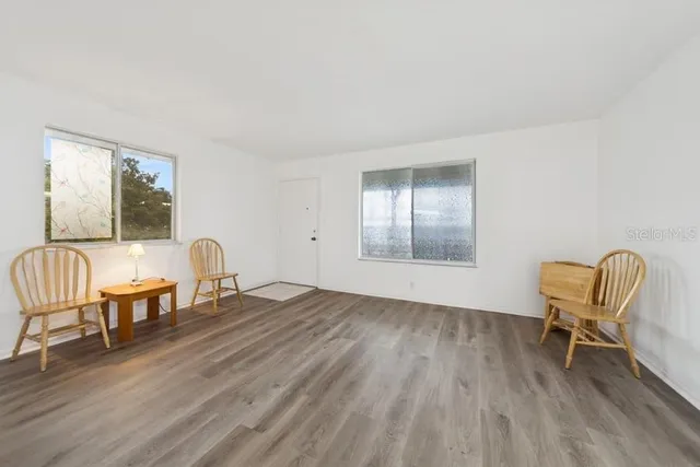 a view of a livingroom with furniture and wooden floor