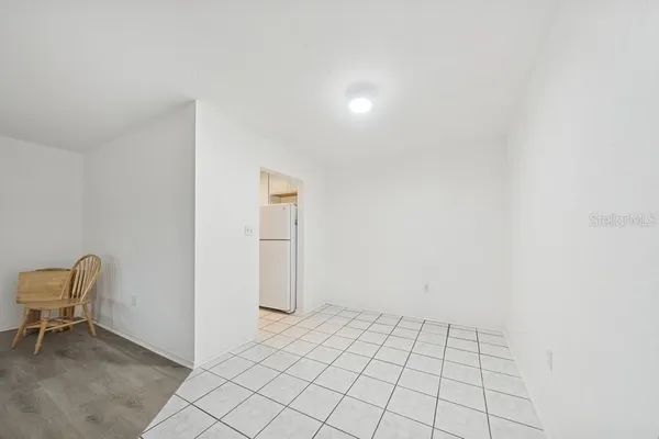 a view of an empty room and fire place