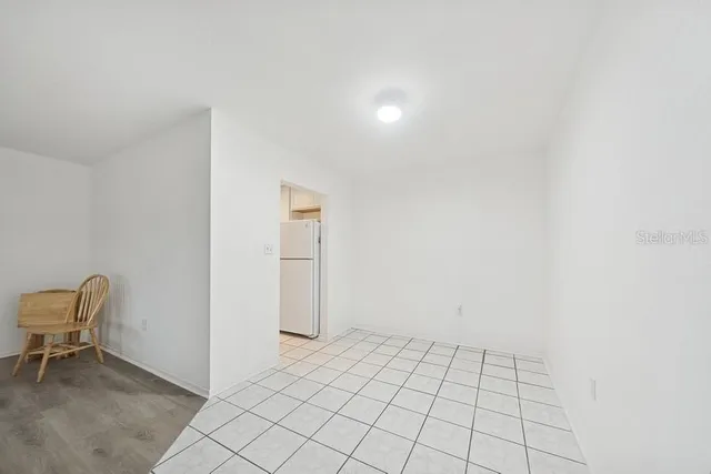 a view of an empty room and fire place