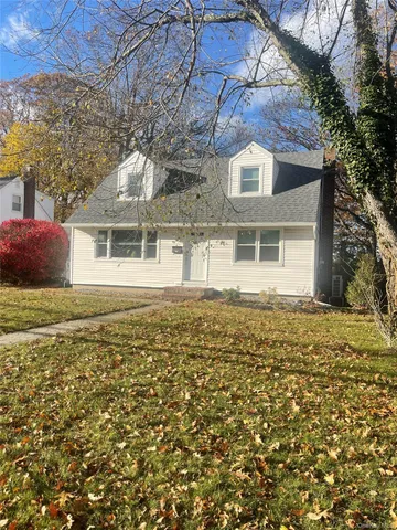 front view of a house with a garden