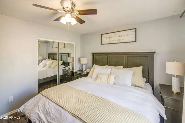 a bedroom with a bed and a lamp