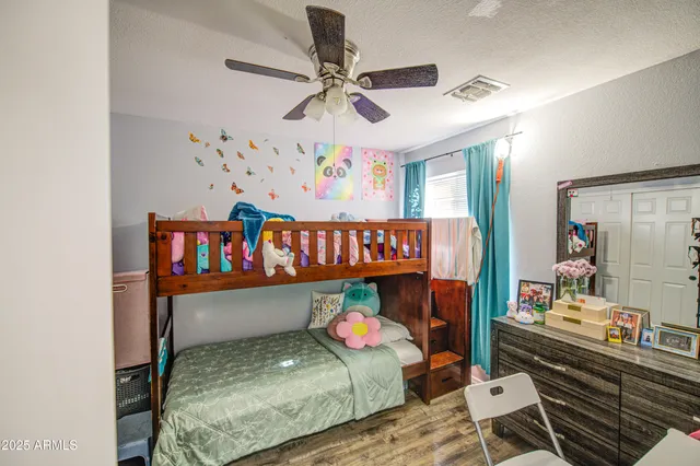 a bedroom with furniture and a window