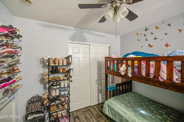 a bedroom with furniture and a book shelf