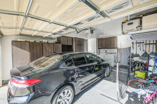 a bedroom with furniture and a chandelier