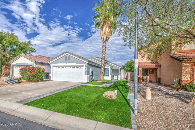 front view of a house with a yard