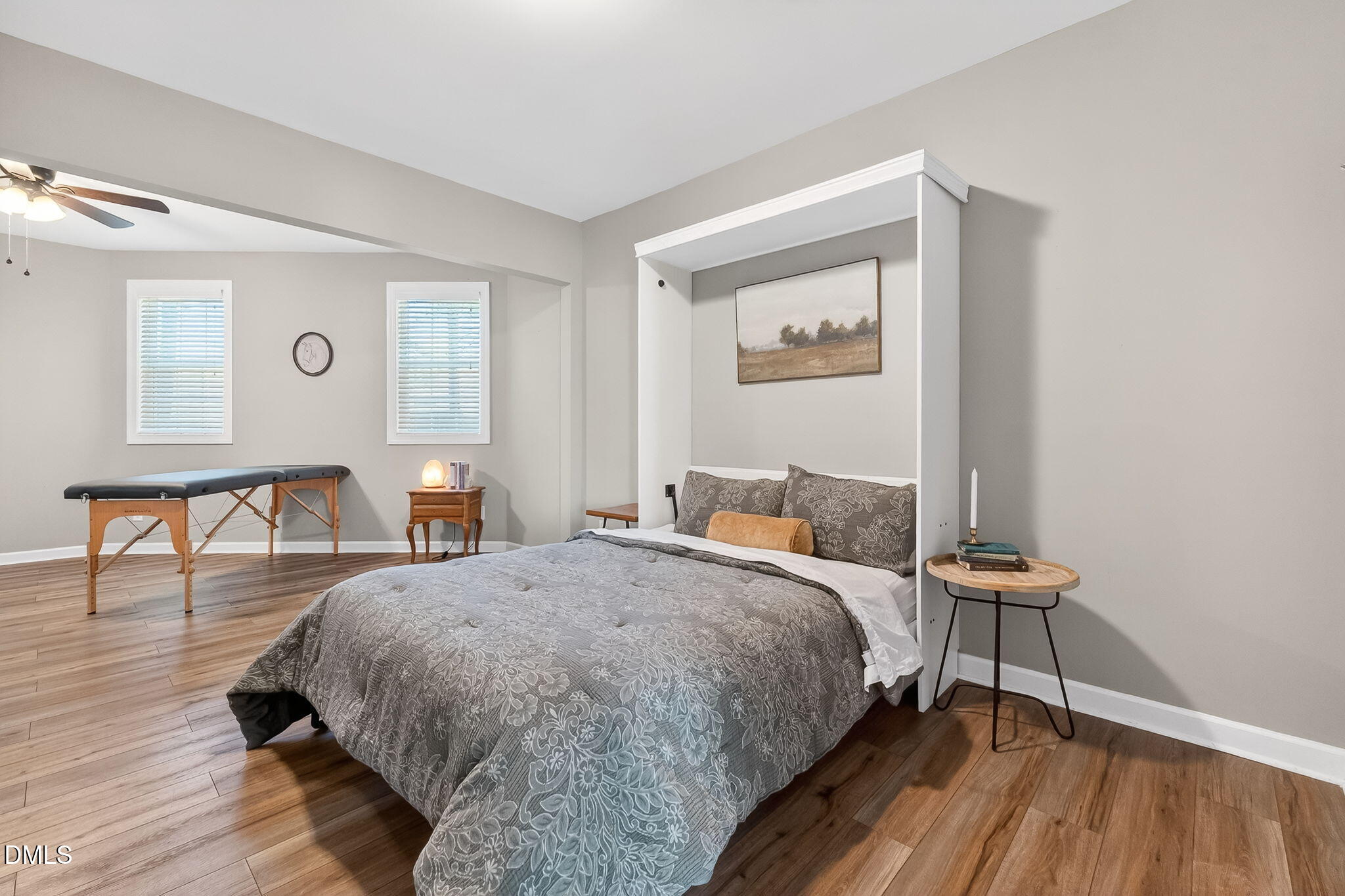 625 Toledo Court Rolesville, NC 27571 - Photo 11 of 69 a bedroom with a bed and a table with wooden floor