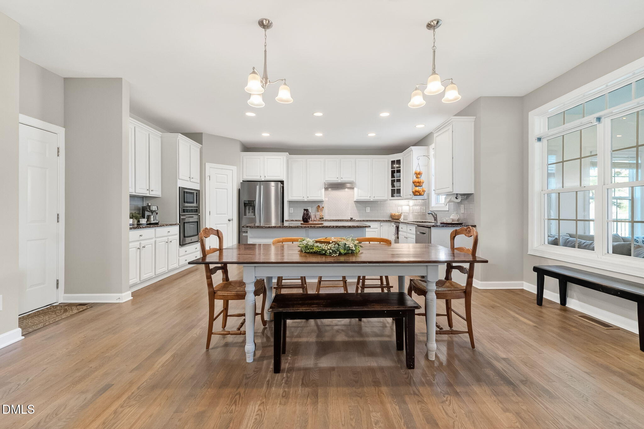 625 Toledo Court Rolesville, NC 27571 - Photo 21 of 69 a view of a dining room with furniture wooden floor and chandelier