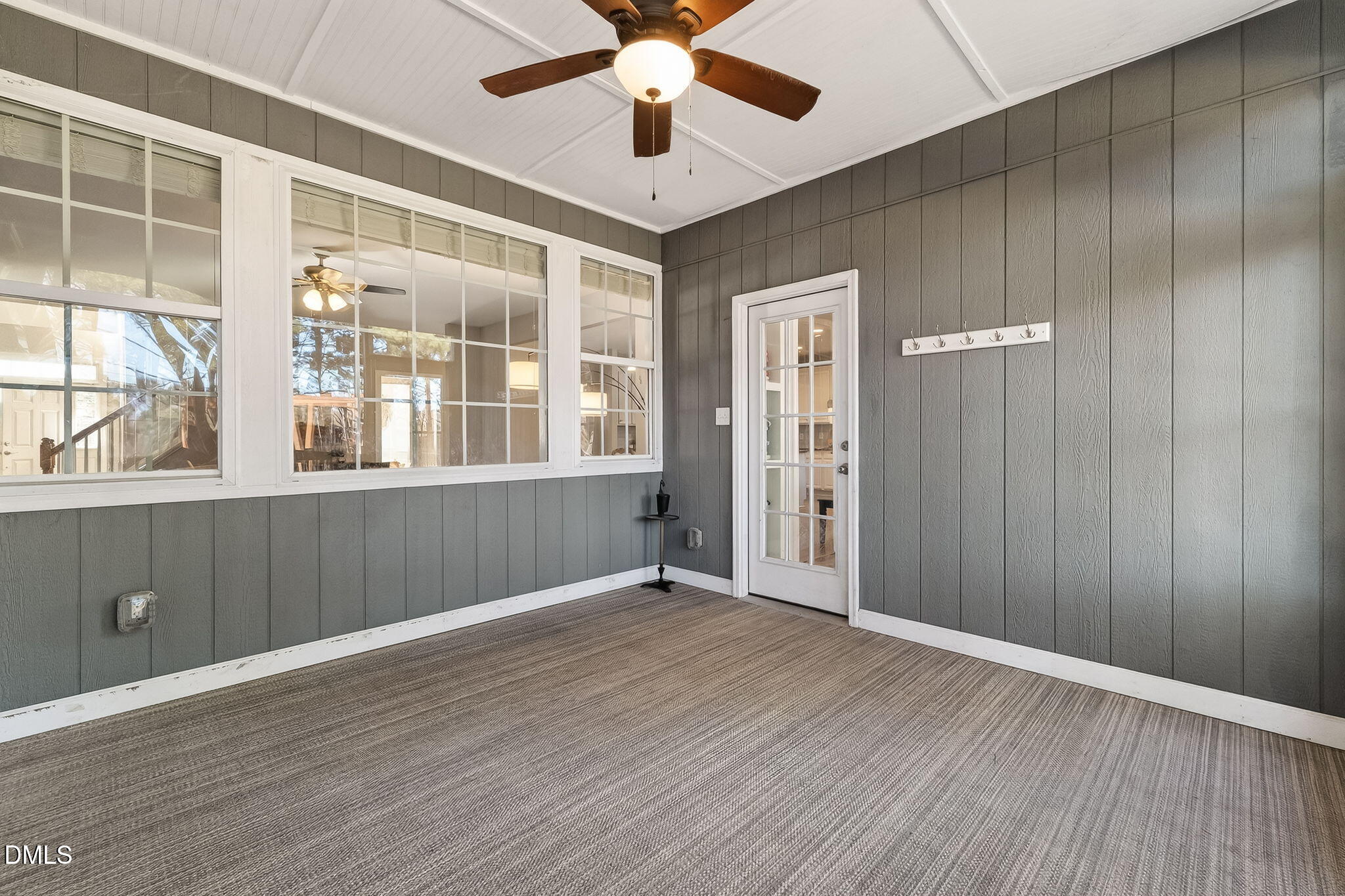 625 Toledo Court Rolesville, NC 27571 - Photo 27 of 69 a view of an empty room with a window and wooden floor