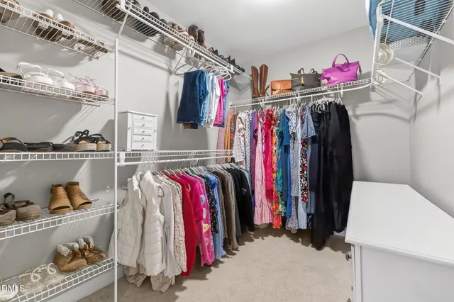 a bed room with a bed and a window