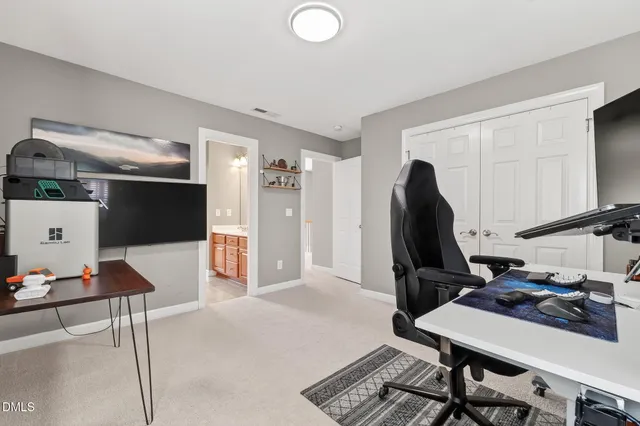 a view of swimming pool with a bench and trees