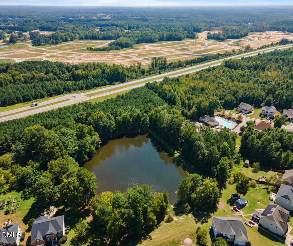 625 Toledo Court Rolesville, NC 27571 - Photo 64 of 69 an aerial view of a houses with a yard and lake view