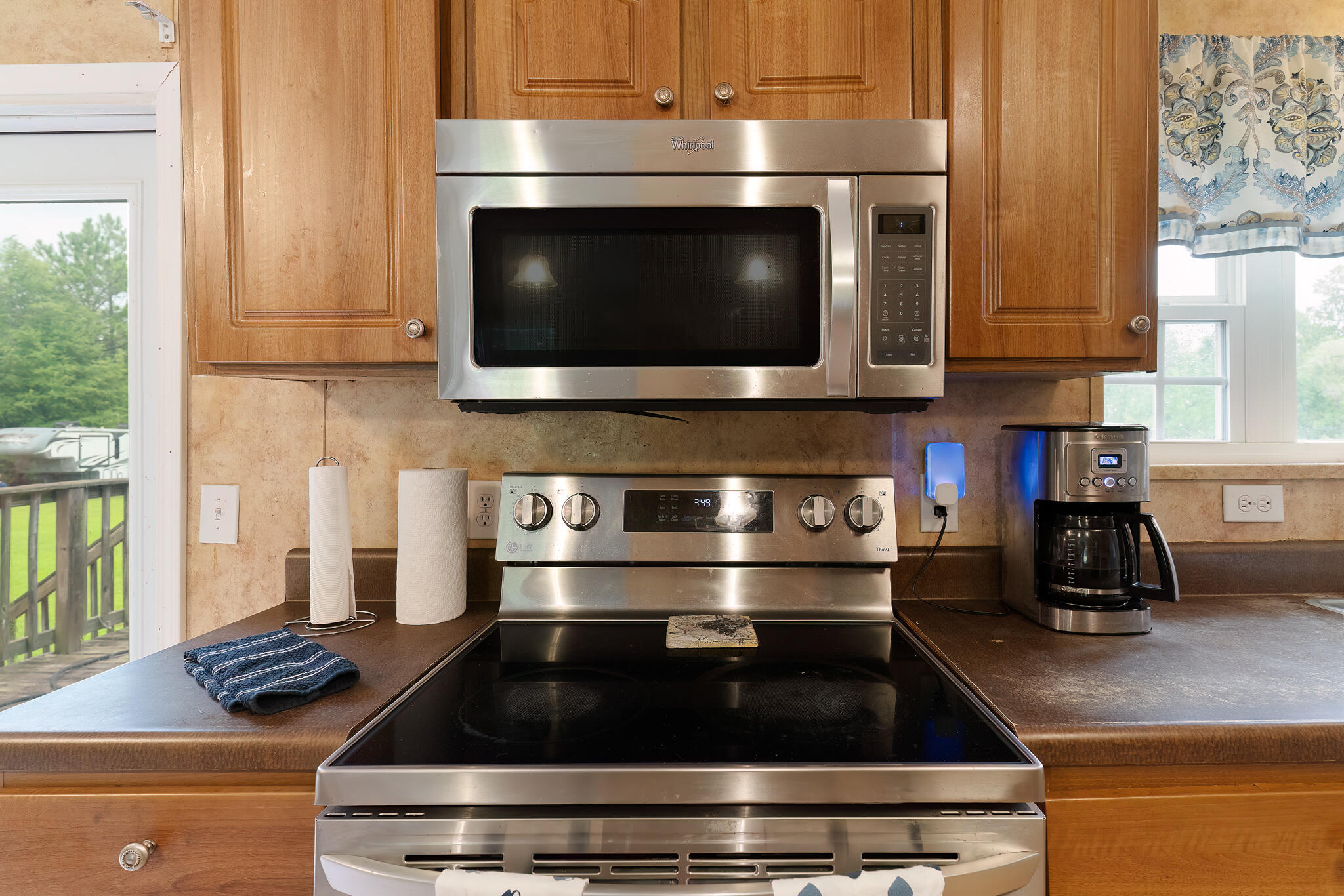 2050 Shockley Springs Road Baker, FL 32531 - Photo 12 of 49 a kitchen with a stove and a microwave