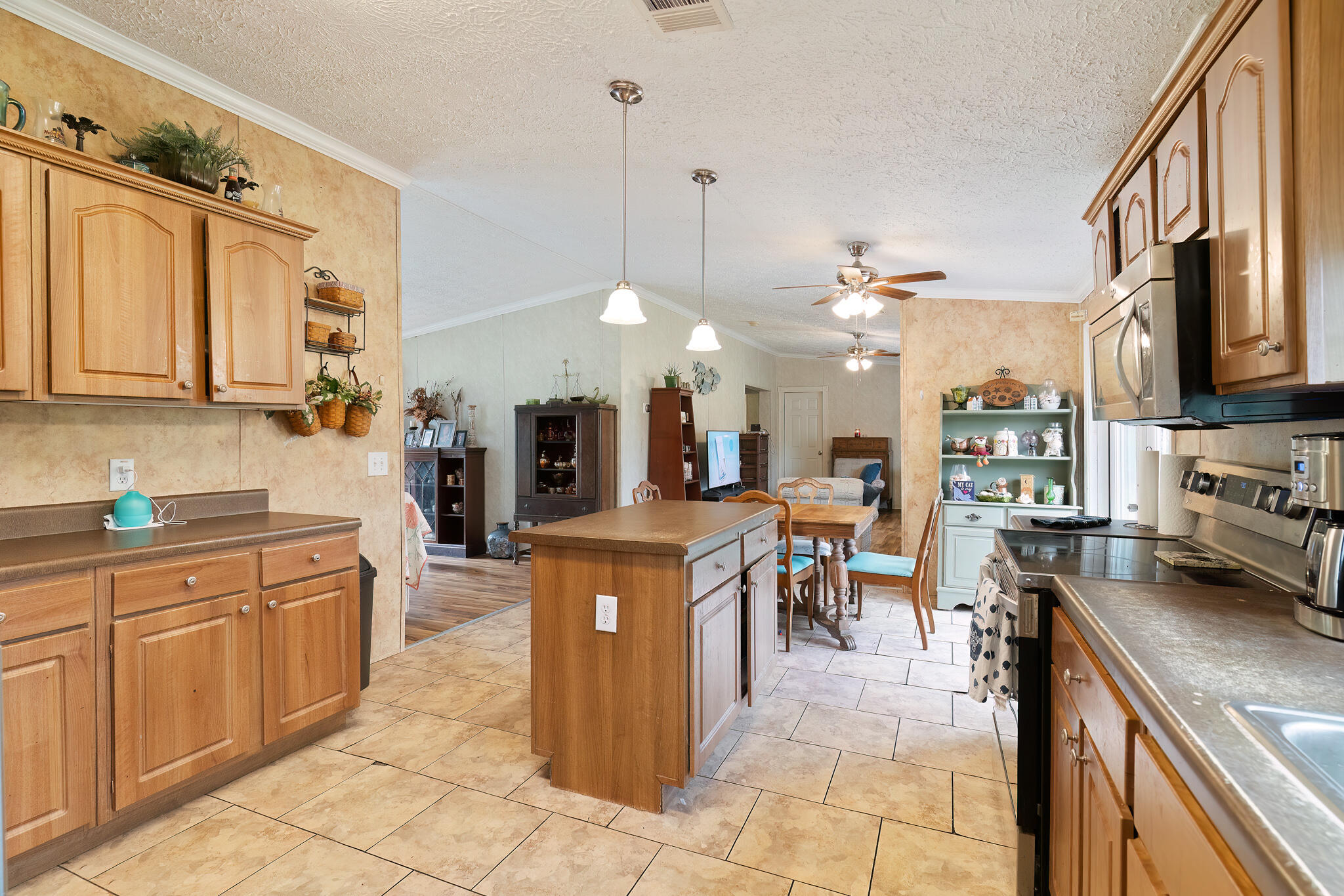 2050 Shockley Springs Road Baker, FL 32531 - Photo 14 of 49 a kitchen with stainless steel appliances granite countertop a stove top oven a sink a counter top space and cabinets