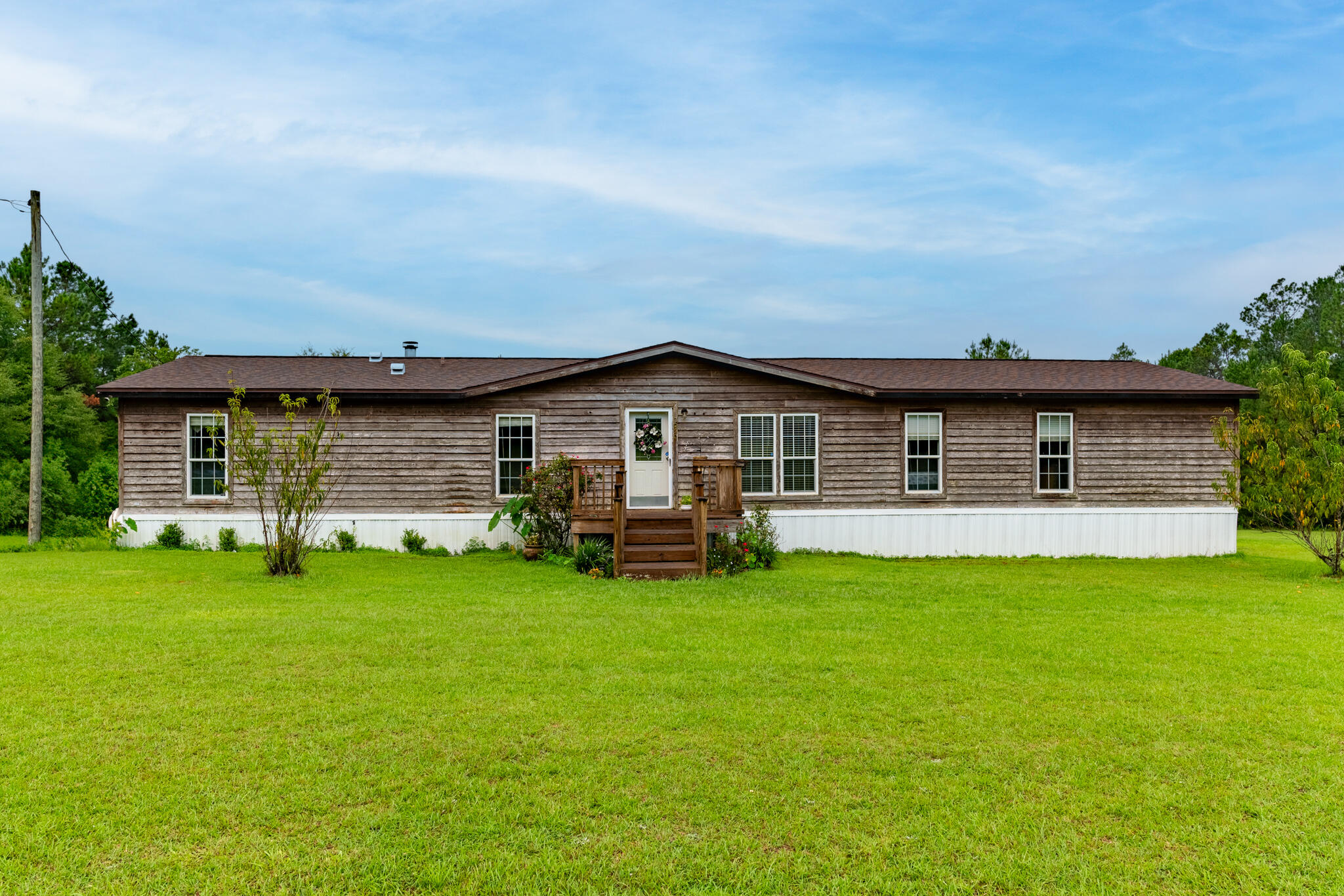 2050 Shockley Springs Road Baker, FL 32531 - Photo 2 of 49 a view of a house with a yard and sitting area