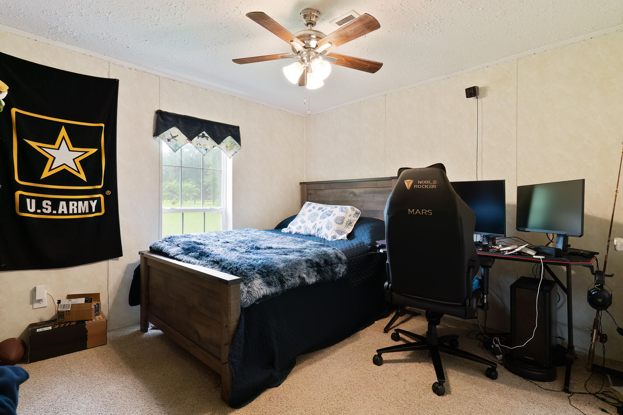 2050 Shockley Springs Road Baker, FL 32531 - Photo 26 of 49 a bedroom with a bed and a desk