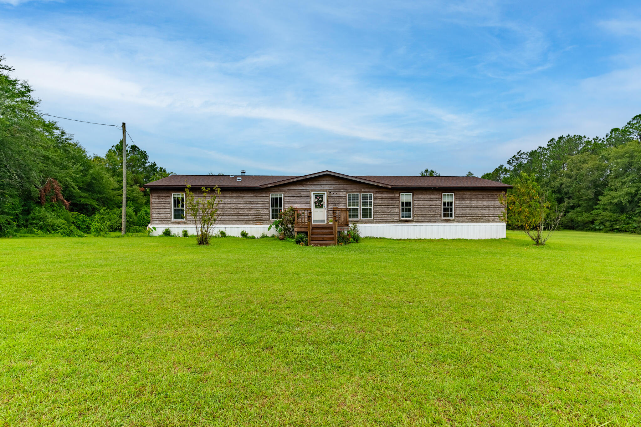 2050 Shockley Springs Road Baker, FL 32531 - Photo 47 of 49 a view of a house with a big yard