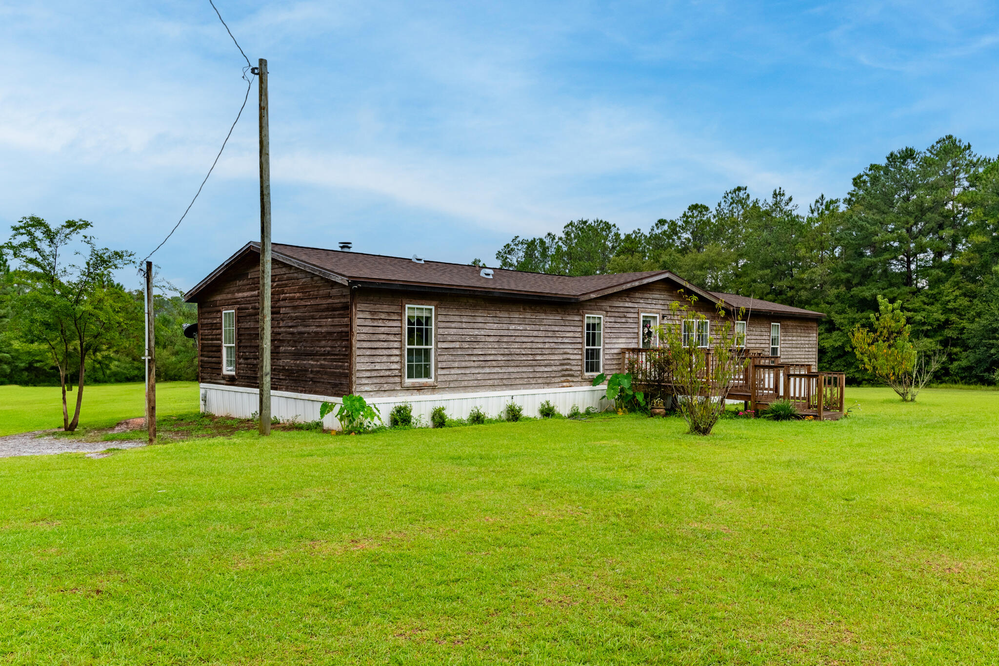 2050 Shockley Springs Road Baker, FL 32531 - Photo 48 of 49 a view of a house with a backyard