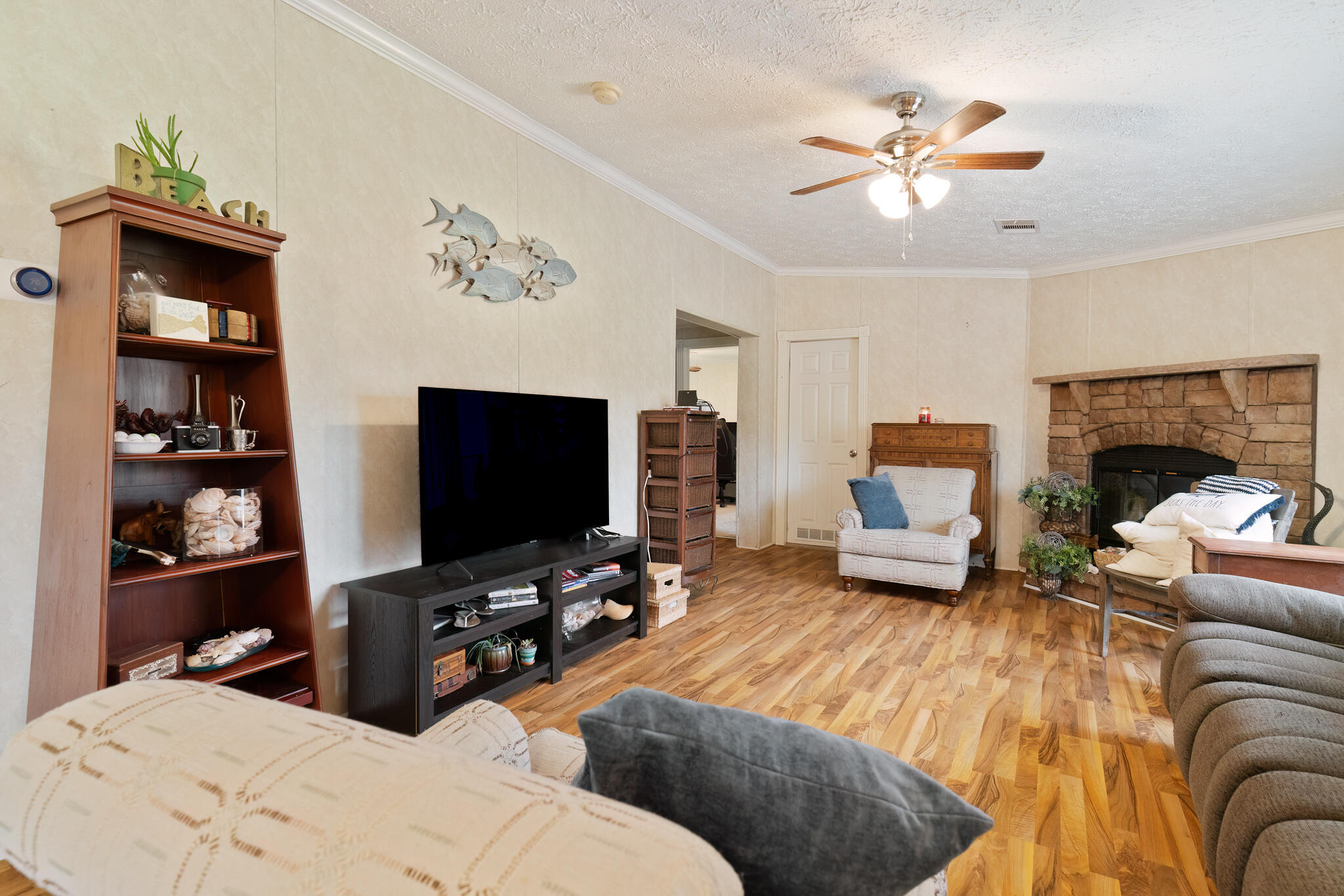 2050 Shockley Springs Road Baker, FL 32531 - Photo 8 of 49 a living room with furniture and a flat screen tv
