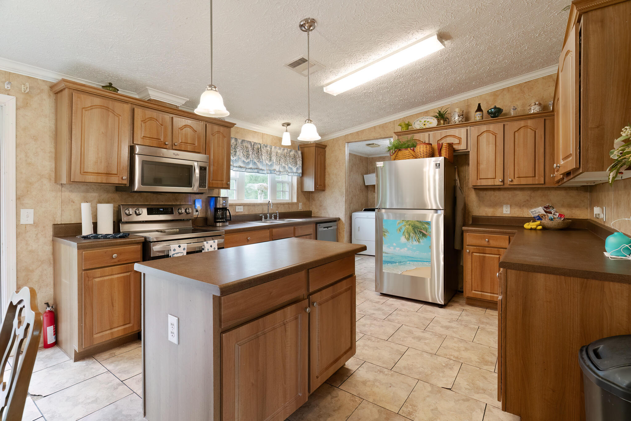 2050 Shockley Springs Road Baker, FL 32531 - Photo 10 of 49 a kitchen with stainless steel appliances granite countertop a refrigerator a stove top oven a sink and dishwasher