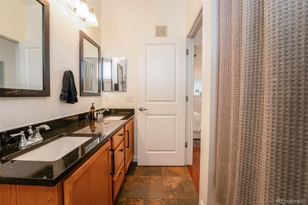 a kitchen with a sink and a refrigerator