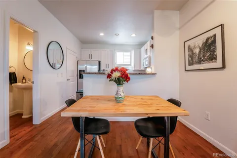 a view of a dining room with furniture and wooden floor